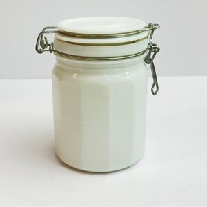 Vtg white milk glass storage‎ jar w/ a wire bail closure & a 12-sided design